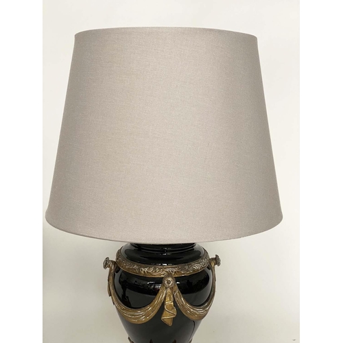 155 - TABLE LAMPS, a pair, black ceramic and gilt metal mounted of vase form with shades, 75cm H. (2)