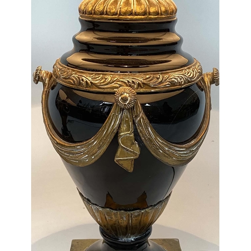 155 - TABLE LAMPS, a pair, black ceramic and gilt metal mounted of vase form with shades, 75cm H. (2)