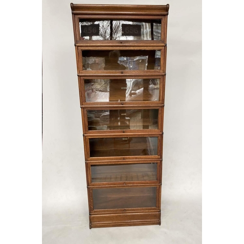 158 - GLOBE WERNICKE BOOKCASE, early 20th century oak comprising seven graduated glazed sections with corn... 