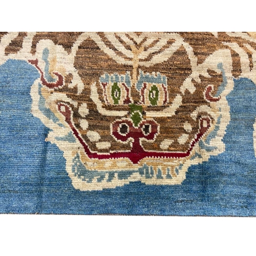 119 - FINE TIBETAN TIGER RUG, 228cm x 168cm.