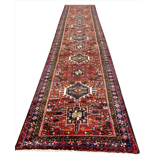 128 - PERSIAN HERIZ LONG RUNNER, 402cm x 82cm.