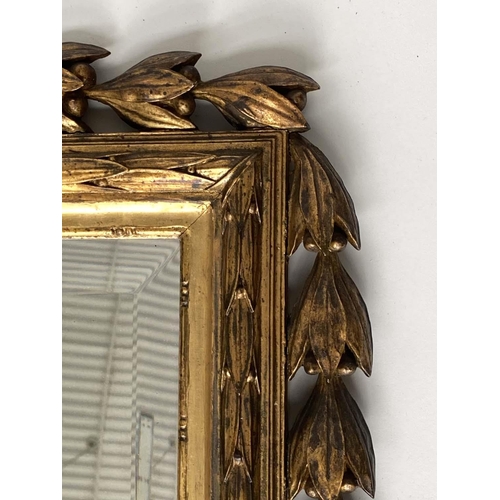 168 - WALL MIRROR, French 19th century Louis XVI style carved giltwood with urn crest, bell husk swags and... 