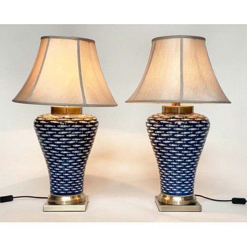 142 - TABLE LAMPS, a pair, ceramic blue and white myriad fish pattern of tapering form with shades, 75cm. ... 