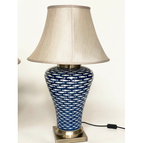 142 - TABLE LAMPS, a pair, ceramic blue and white myriad fish pattern of tapering form with shades, 75cm. ... 