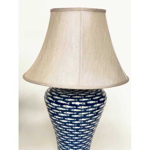 142 - TABLE LAMPS, a pair, ceramic blue and white myriad fish pattern of tapering form with shades, 75cm. ... 