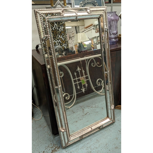 601 - LOUISE BRADLEY WALL MIRROR, 124cm x 66cm, silvered and mirrored frame.