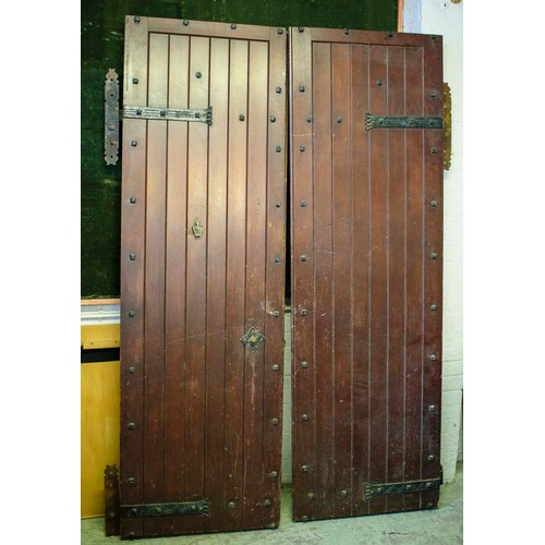 253 - DOORS, each 231cm H x 75cm excluding hinges, a pair, early 20th century stained pine and iron mounte... 