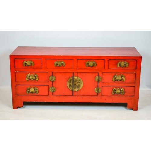 255 - CHINESE LACQUER CABINET, in rouge lacquer of eight drawers and a single central cabinet, 133cm x 60c... 