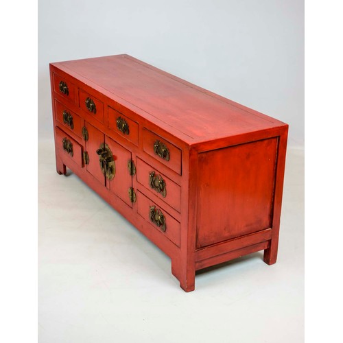 255 - CHINESE LACQUER CABINET, in rouge lacquer of eight drawers and a single central cabinet, 133cm x 60c... 