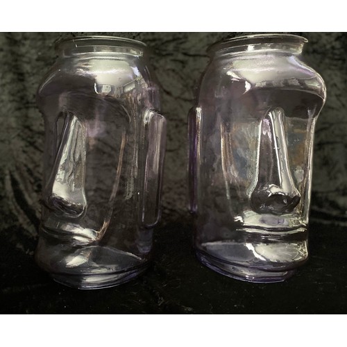 518 - RAPS NUI STYLE VASES, a set of four, two in lilac tinted glass, and two in green tinted glass, 35cm ... 