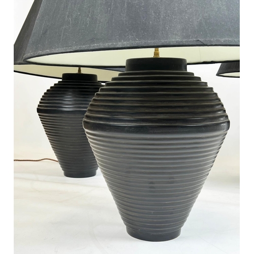 107 - TABLE LAMPS, a set of three, black ceramic ribbed design with shades, 75cm H. (3)