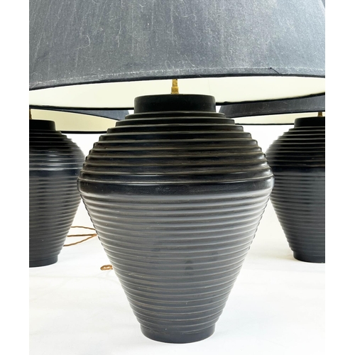 107 - TABLE LAMPS, a set of three, black ceramic ribbed design with shades, 75cm H. (3)