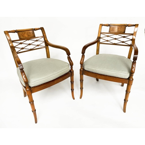 121 - ARMCHAIRS, a pair, Regency design walnut with tablet and lattice backs and cane seats (with cushions... 