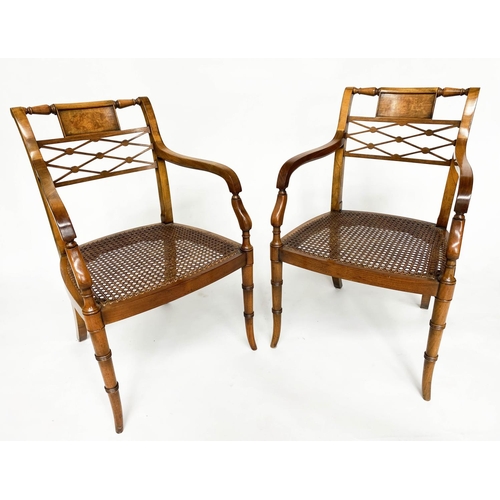 121 - ARMCHAIRS, a pair, Regency design walnut with tablet and lattice backs and cane seats (with cushions... 