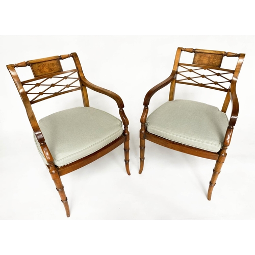 121 - ARMCHAIRS, a pair, Regency design walnut with tablet and lattice backs and cane seats (with cushions... 