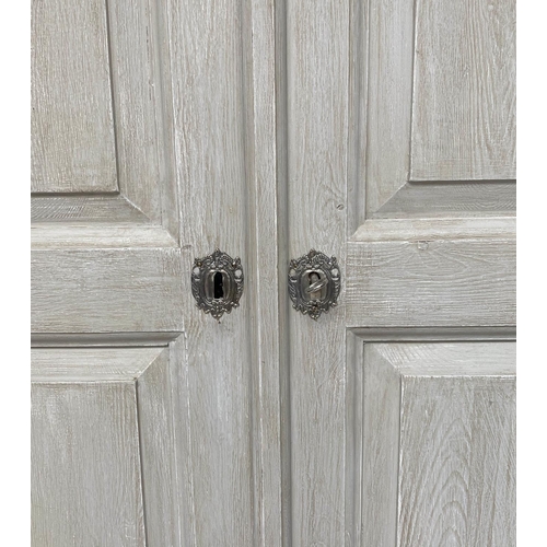 130 - ARMOIRE, French traditionally grey painted with two panelled doors enclosing hanging above a full wi... 