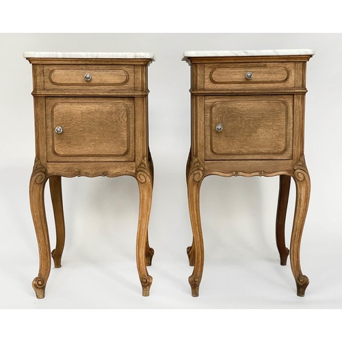 149 - BEDSIDE CABINETS, a pair, 19th century French oak each with drawer and panelled door and cabriole su... 