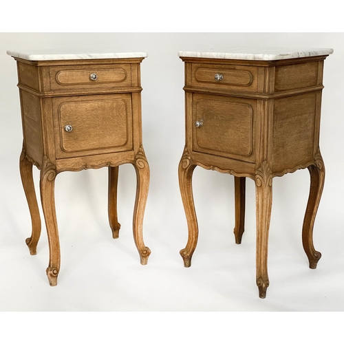 149 - BEDSIDE CABINETS, a pair, 19th century French oak each with drawer and panelled door and cabriole su... 