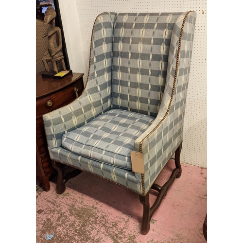 156 - OS DE MOUTON WING ARMCHAIR, late 19th century French oak with ikat upholstery, 115cm H x 72m.