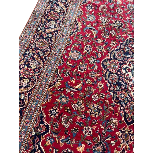 89 - FINE PERSIAN SIGNED KASHAN CARPET, 338cm x 218cm.