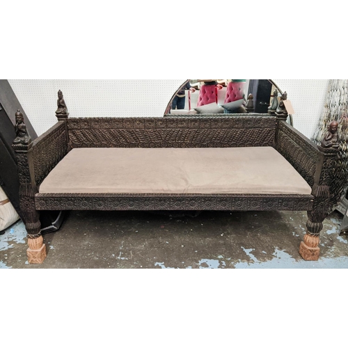 176 - NEPALESE DAYBED, 195cm W, carved wood with later alcantara seat cushion.