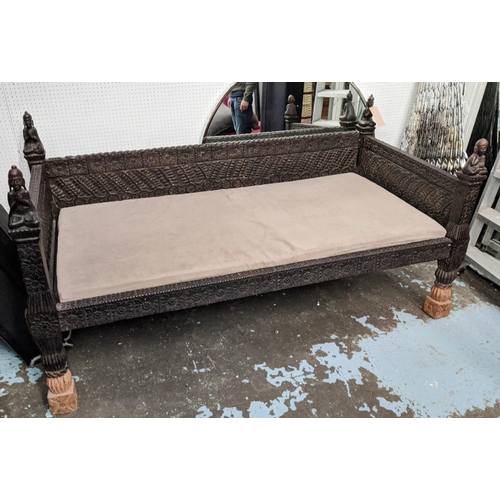 176 - NEPALESE DAYBED, 195cm W, carved wood with later alcantara seat cushion.