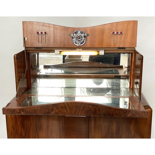 118 - ART DECO COCKTAIL CABINET, figured walnut with rising mirror lined cabinet above two panel doors, 93... 