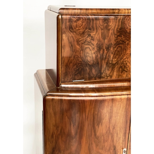 118 - ART DECO COCKTAIL CABINET, figured walnut with rising mirror lined cabinet above two panel doors, 93... 