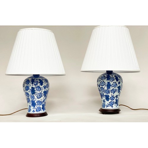 112 - TABLE LAMPS, a pair, Chinese blue and white ceramic vase form with wooden bases and shades, 57cm H. ... 