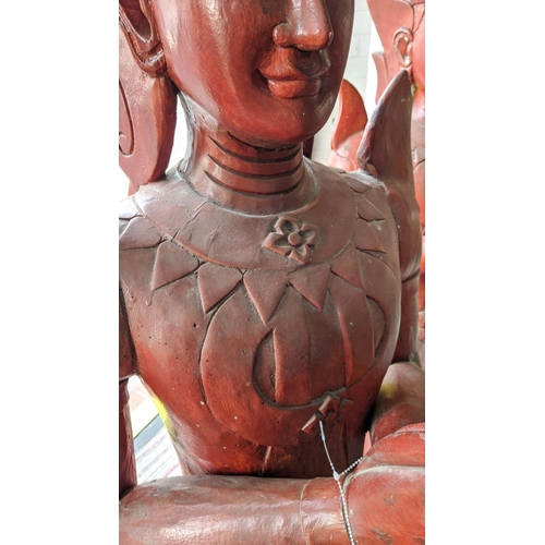 310 - THIA THEPPANOM COUPLE, carved wood, red lacquered finish, 128cm H. (2)