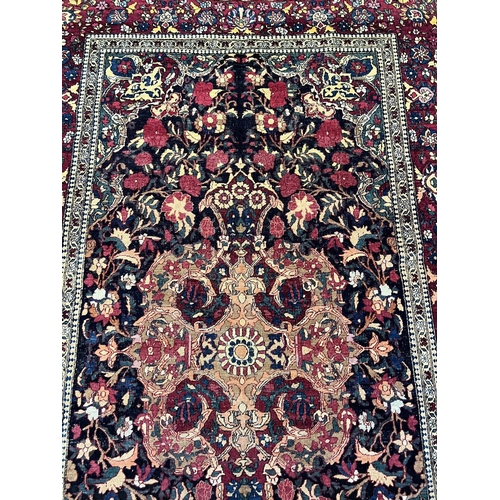 109 - ANTIQUE ISPHAHAN RUG, 222cm x 135cm.