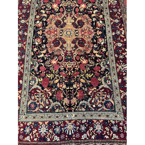 109 - ANTIQUE ISPHAHAN RUG, 222cm x 135cm.