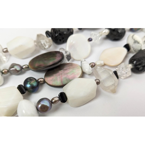 17 - A COLLECTION OF SEMIPRECIOUS GEMSTONE JEWELLERY, comprising a howlite and mother-of-pearl seven stra... 