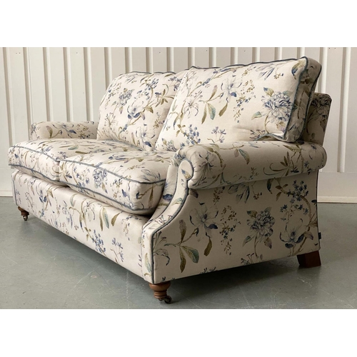 175 - SOFA, Country House style foliate printed upholstery, scroll arms, feather pads and turned front sup... 