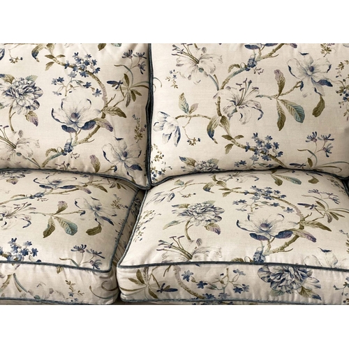 175 - SOFA, Country House style foliate printed upholstery, scroll arms, feather pads and turned front sup... 