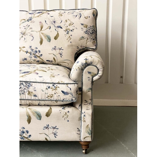 175 - SOFA, Country House style foliate printed upholstery, scroll arms, feather pads and turned front sup... 