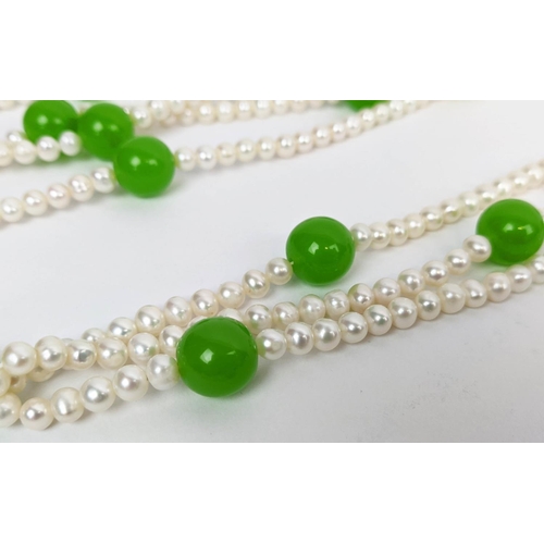 18 - A FRESHWATER PEARL AND GREEN DYED SIMULATED JADE NECKLACE, BRACELET AND EARRING SET, comprising one ... 