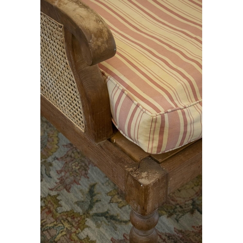 247 - BERGERE, 97cm H x 74cm W x 90cm D, Colonial style teak and caned with striped squab and loose Bennis... 