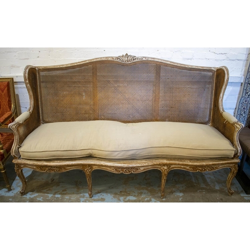 380 - CANAPE, 121cm H x 200cm W x 71cm D, Louis XV style with distress finished frame, caned back and squa... 