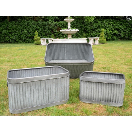 381 - GARDEN TUB PLANTERS, graduated set of three, largest 33cm high, 60cm wide, 38cm deep, galvanised met... 