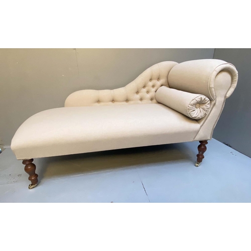 384 - CHAISE LONGUE, Victorian style neutral linen upholstery, turned supports, 72cm x 135cm x 54cm D.