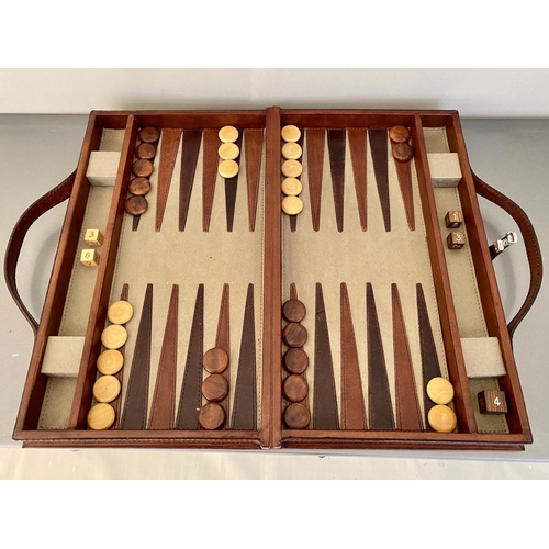 389 - BACKGAMMON SET, in leathered case, 7cm x 23cm x 40cm.