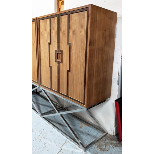 413 - DRINKS CABINET ON STAND, 115cm x 55cm x 182.5cm, metal detail to doors, enclosing three shelves and ... 