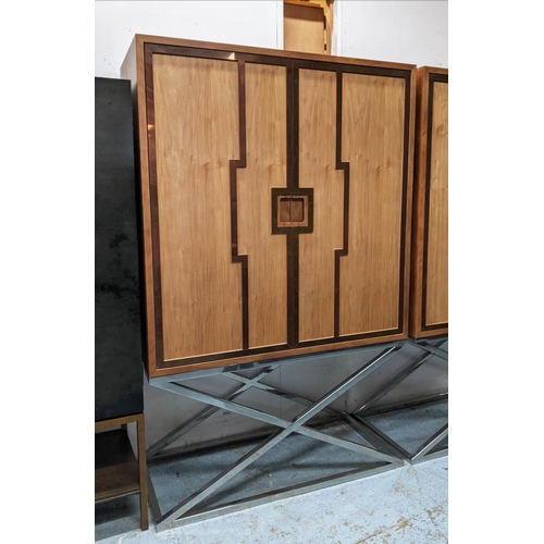 414 - MEDIA CABINET ON STAND, 115cm x 55cm x 182.5cm, metal work detail to doors which tuck away revealing... 