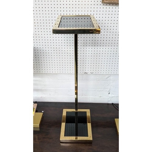 421 - MARTINI TABLE, gilt metal, two smoked glass tiers, 31cm x 20cm x 72cm.