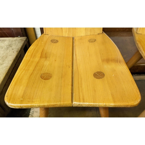 242 - SWISS HALL CHAIRS, each 93cm H x 35cm W x 46cm D, a set of four ash. (4)