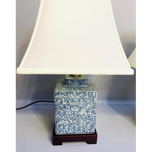 268 - TABLE LAMPS, a pair, Chinese export style blue and white ceramic, with shades, 42cm x 28cm x 28cm.