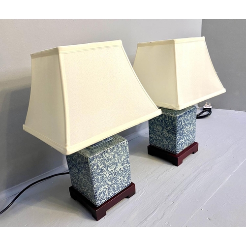 268 - TABLE LAMPS, a pair, Chinese export style blue and white ceramic, with shades, 42cm x 28cm x 28cm.