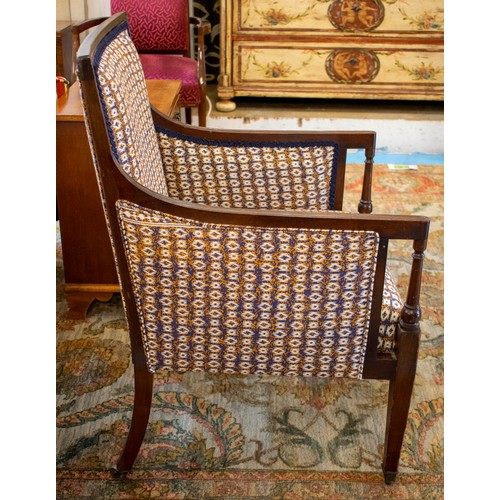 228 - BERGERE, 90cm H x 59cm W, Edwardian mahogany in patterned blue upholstery on brass castors