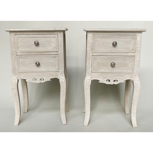 193 - BEDSIDE TABLES, a pair, French style grey painted each with two drawers and carved, pierced apron, 4... 